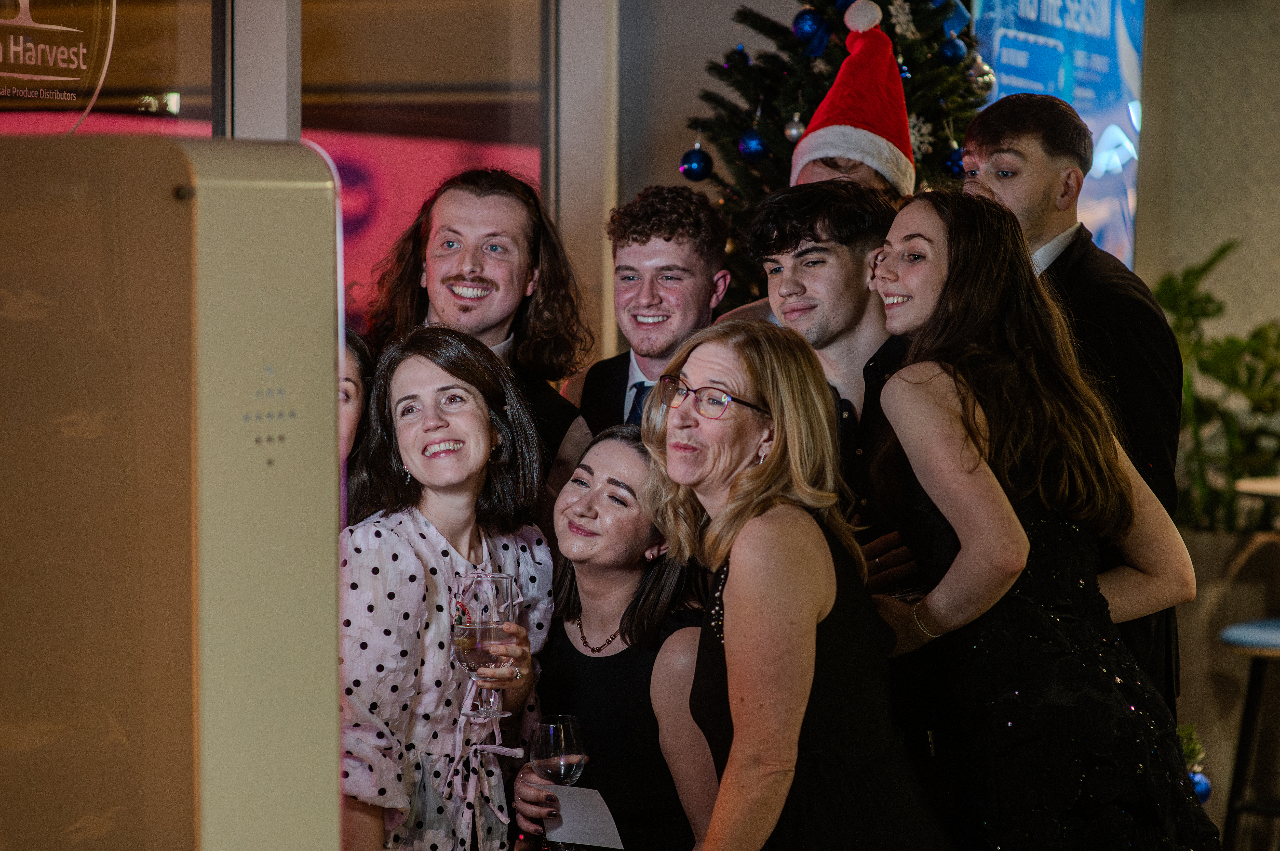 Christmas party goers at a photobooth
