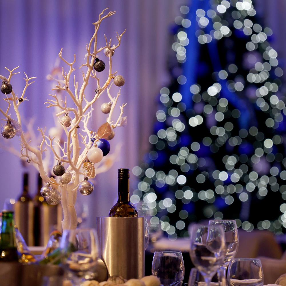 View of a wine bottle and a Christmas tree