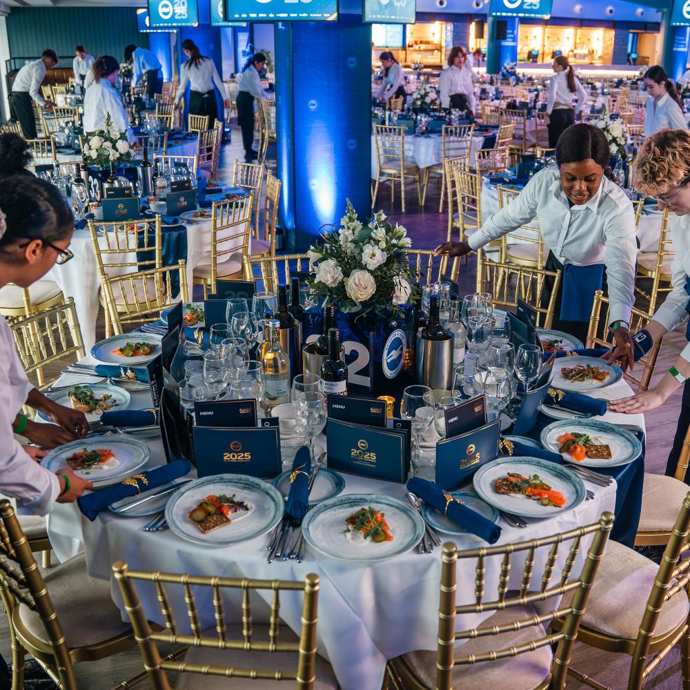 Table at an event ceremony being set up