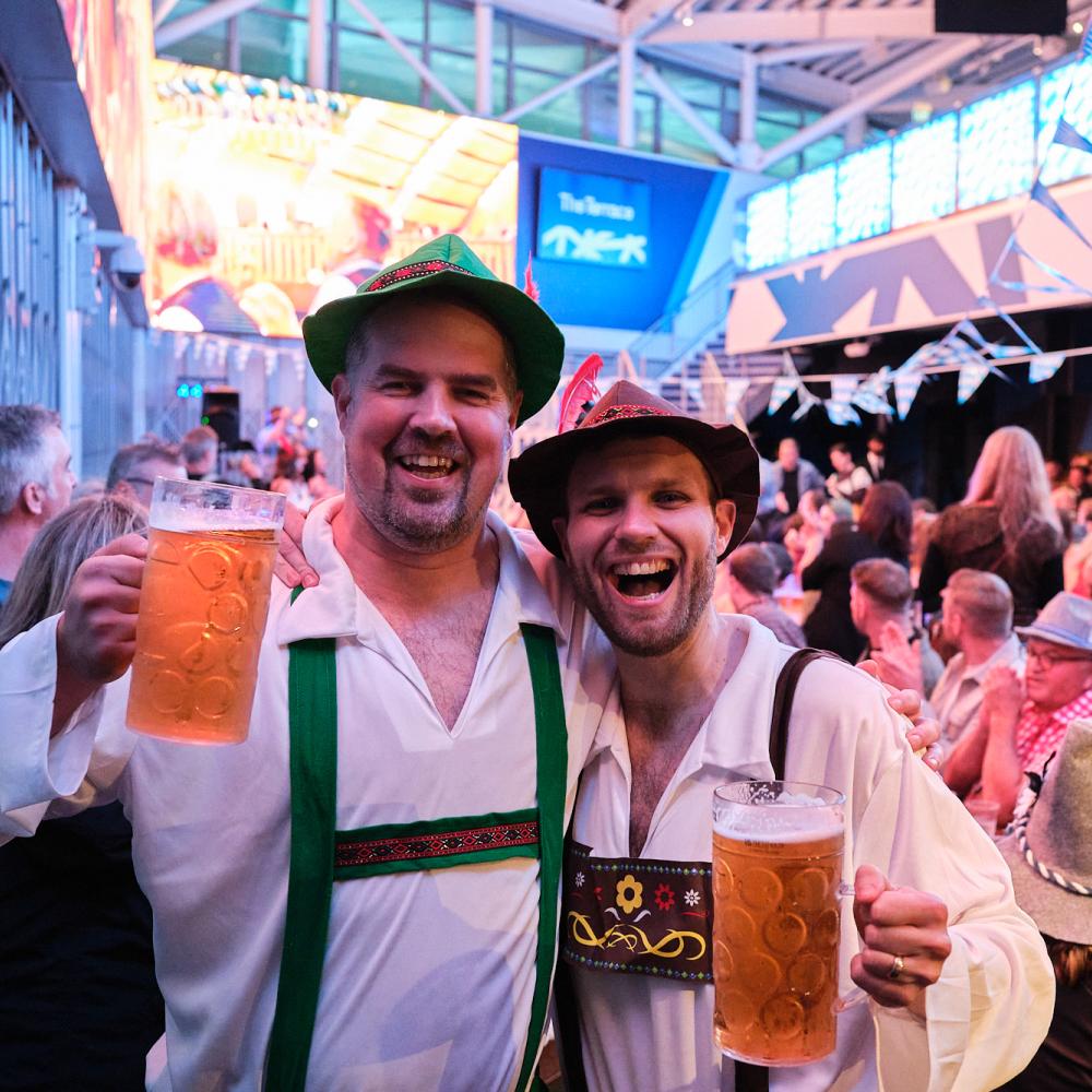 People holding beers at Oktoberfest