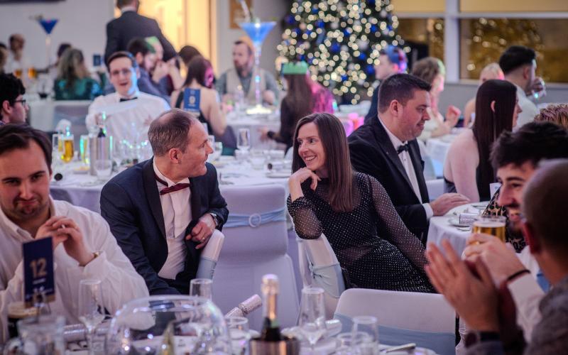 People talking at a Christmas party