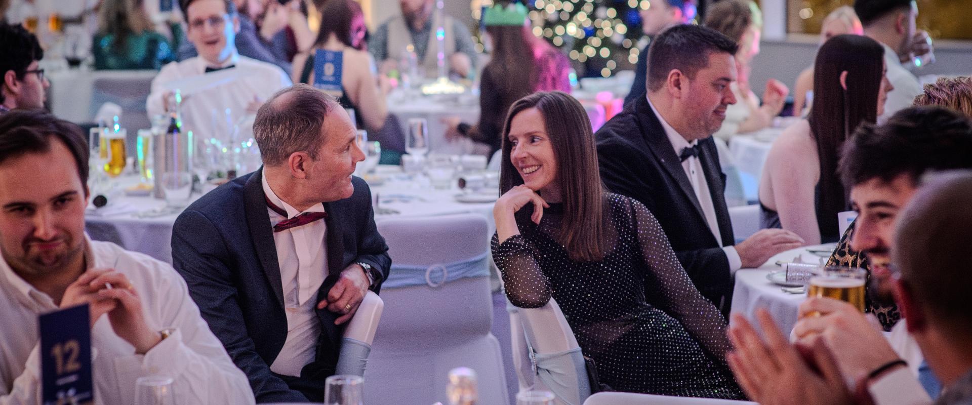 People talking at a Christmas party