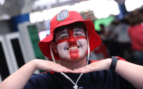 Man decorated with England face paint